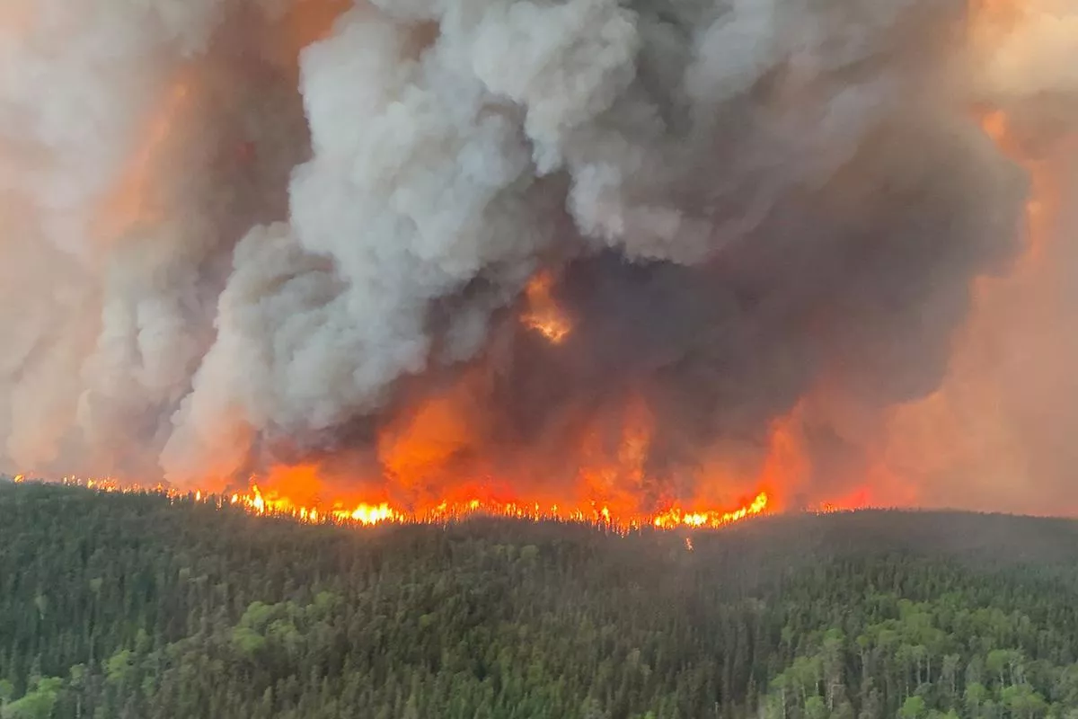Massive wildfire engulfs western Canada, thousands evacuated